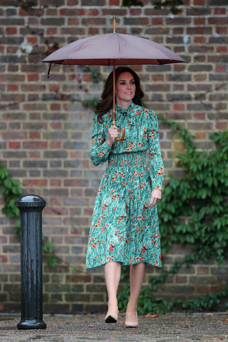 Kate chose a floral Prada dress to visit Kensington Palace’s White Garden [Photo: PA]