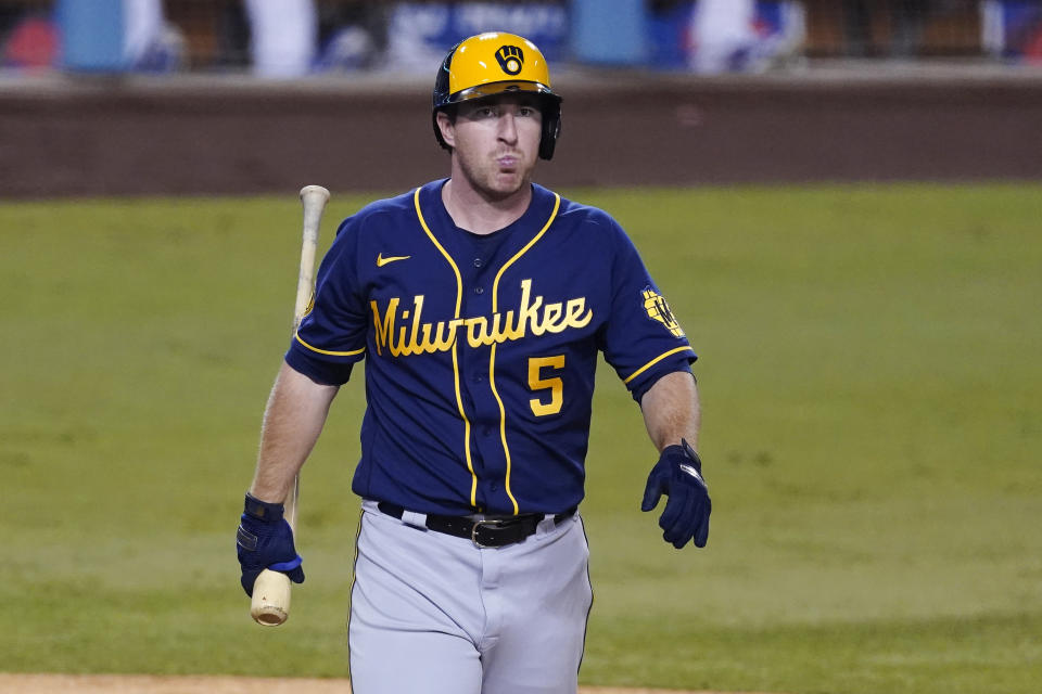 FILE - In this Thursday, Oct. 1, 2020, file photo, Milwaukee Brewers' Jedd Gyorko (5) walks back to the dugout after an at-bat against the Los Angeles Dodgers during Game 2 of a National League wild-card baseball series against the Los Angeles Dodgers in Los Angeles. The Brewers have declined 2021 options on infielders Jedd Gyorko and Eric Sogard as well as outfielder Ben Gamel. (AP Photo/Ashley Landis, File)