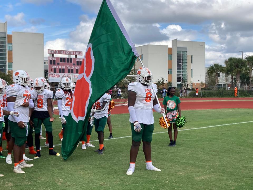 Jones junior defensive lineman D'antre Robinson (6) prepares to lead the Tigers onto the field against Edgewater in the Region 1-3M championship game on Nov. 26, 2022 in Orlando.