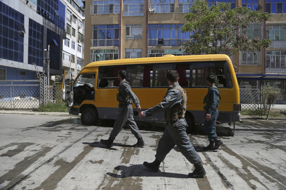 Afghan Security Police arrives at the site of explosions in Kabul, Afghanistan, Sunday, June 2, 2019. Afghan officials say there have been three explosions in the capital, Kabul, including a sticky bomb attached to a bus carrying university students. (AP Photo/Rahmat Gul)