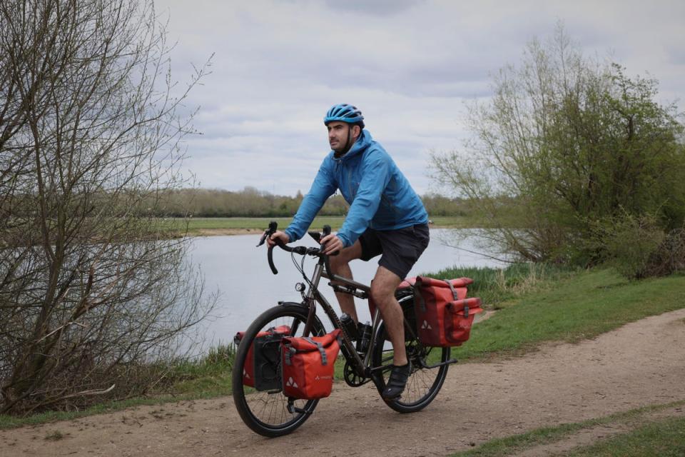 Travel writer Simon Parker on his bike on the Thames Path near Oxford (Matt Writtle)