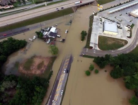 Flood waters cover the area of FM 1463 at IH-10 in Fort Bend County, Texas, U.S. April 19, 2016. Texas DOT-Houston/Handout via REUTERS