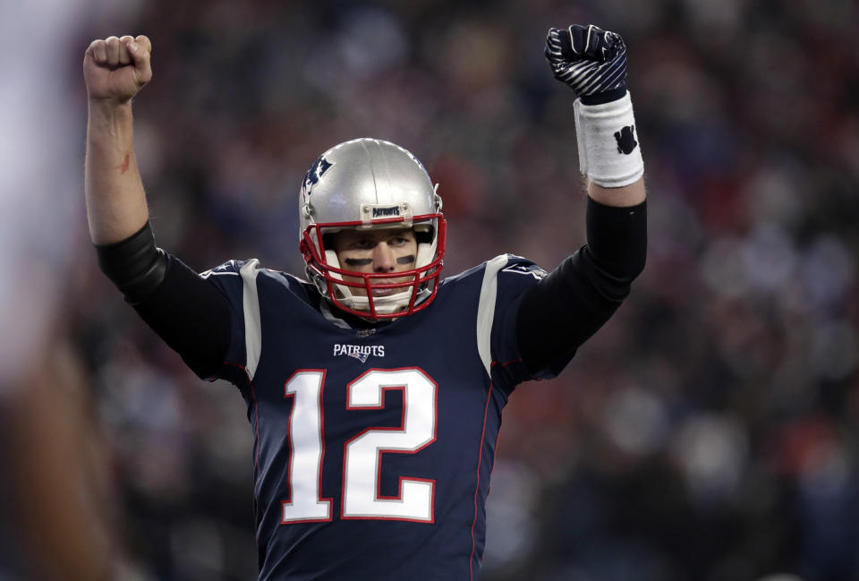 New England Patriots quarterback Tom Brady celebrates a touchdown against the Titans. (AP)