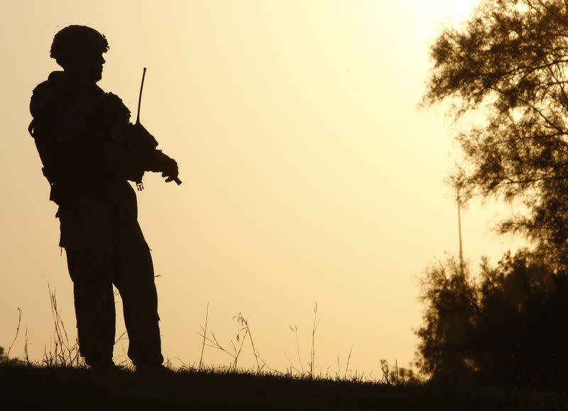 A U.S. soldier stands guard during a peace conference in al-Zawra amusement park in Baghdad