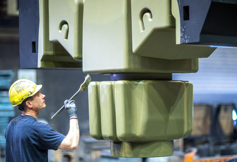 07 August 2020, Mecklenburg-Western Pomerania, Torgelow: An employee cleans a core pressed from sand in the mould construction area of the Torgelow iron foundry. The company, which with 320 employees is one of the most important employers in Western Pomerania, had filed for insolvency in mid-July. Photo: Jens Büttner/dpa-Zentralbild/ZB (Photo by Jens Büttner/picture alliance via Getty Images)