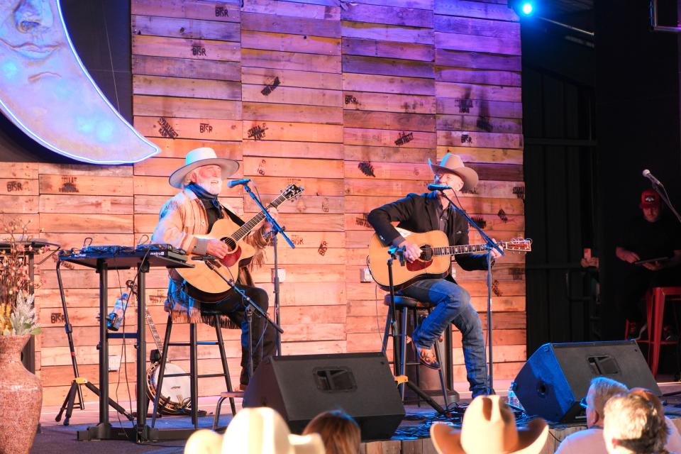 Michael Martin Murphey( left) and Lyle Lovett perform together Sunday evening at the Rangeland Fire Relief Benefit Concert at the Starlight Ranch in Amarillo.