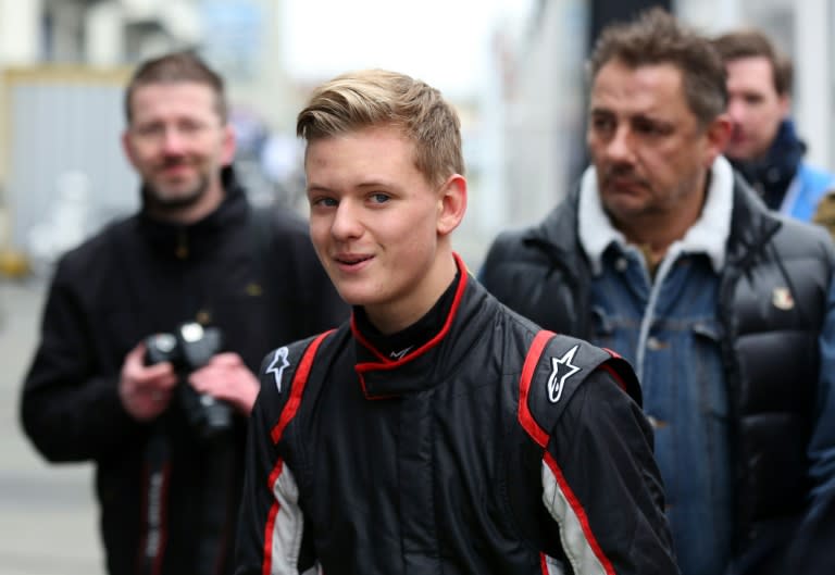 Mick Schumacher, son of former F1 champion Michael Schumacher, walks through the pit lane during the first day of the ADAC Formula Four pre-season tests in Oschersleben, Germany, on April 8, 2015