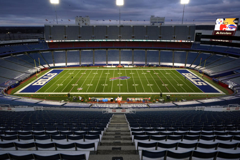 FILE - In this Dec. 13, 2020, file photo, the stadium is mostly empty before an NFL football game between the Buffalo Bills and the Pittsburgh Steelers in Orchard Park, N.Y. A person with direct knowledge of discussions tells The Associated Press the cost of the Bills proposed new stadium is $1.4 billion; the stadium is to be built across the street from the team's existing facility. The person spoke to The AP Thursday, Aug. 12, on the condition of anonymity because the details of proposal haven't been made public. (AP Photo/Gene J. Puskar, File)