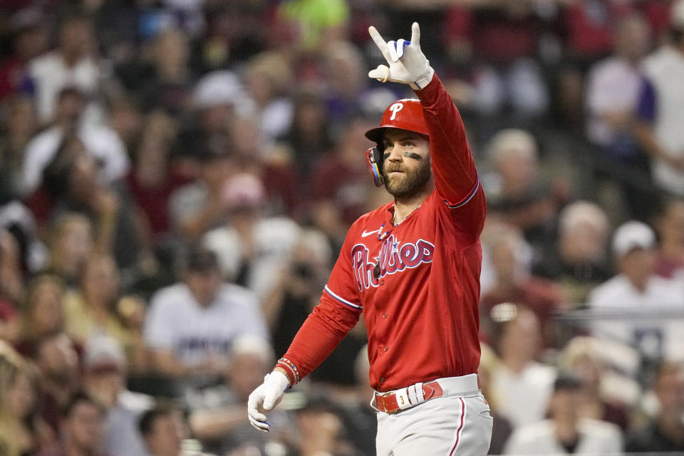 Philadelphia Phillies' Bryce Harper celebrates a home run against the Arizona Diamondbacks during the sixth inning in Game 5 of the baseball NL Championship Series in Phoenix, Saturday, Oct. 21, 2023. (AP Photo/Brynn Anderson)