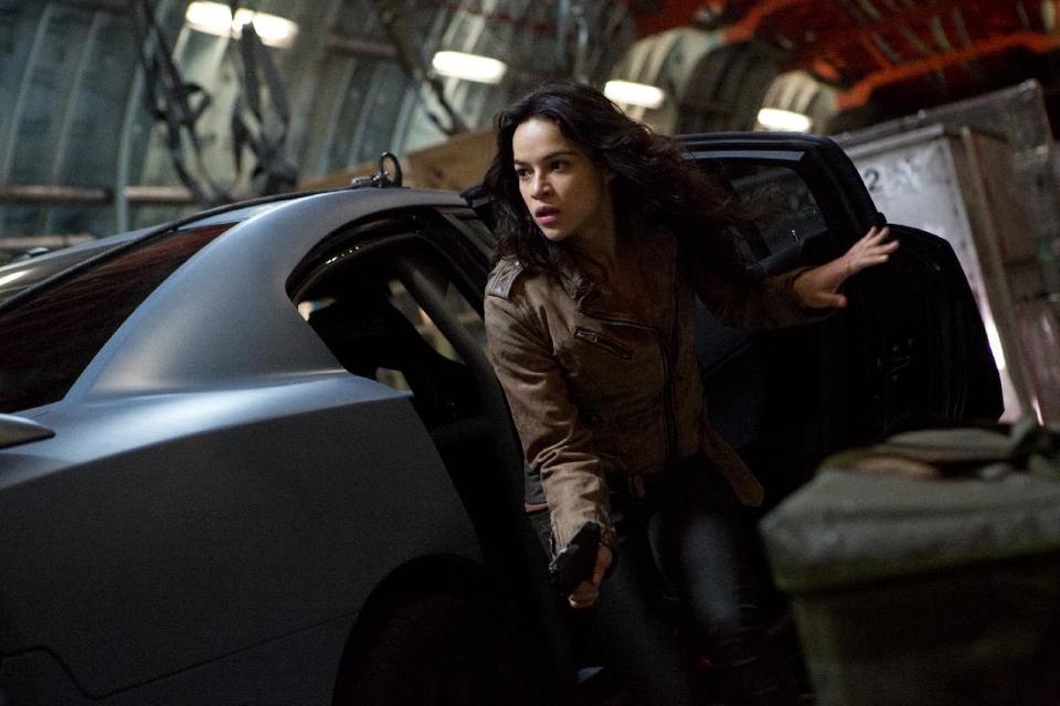 This film publicity image released by Universal Pictures shows Michelle Rodriguez in a scene from "Fast & Furious 6." (AP Photo/Universal Pictures, Giles Keyte)