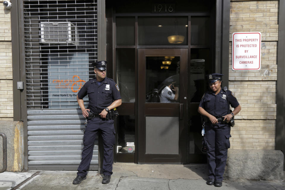FILE - In this Thursday, June 21, 2018 file photo, police stand outside an office for the Cayuga Centers in the Brooklyn borough of New York. Three of the four incidents involving physical harm to separated immigrant children, outlined in legal filings, involved charges of Cayuga Centers, the largest foster care placement for migrant children. (AP Photo/Richard Drew)