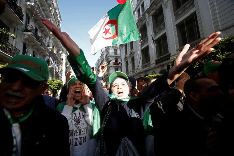 Demonstrators take part in a protest to demand for the presidential election scheduled for next week to be cancelled, in Algiers