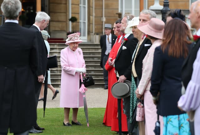 The Queen pictured attending a Buckingham Palace garden party. Yui Mok/PA Wire