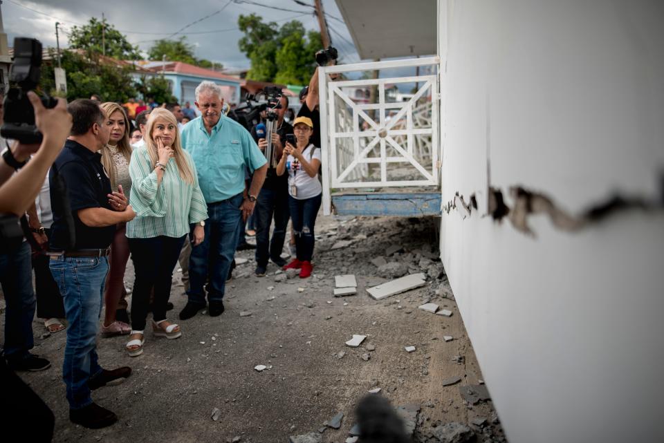 Gov. Wanda Vazquez inspects an earthquake-damaged house in Guanica, Puerto Rico, Monday, Jan. 6, 2020.