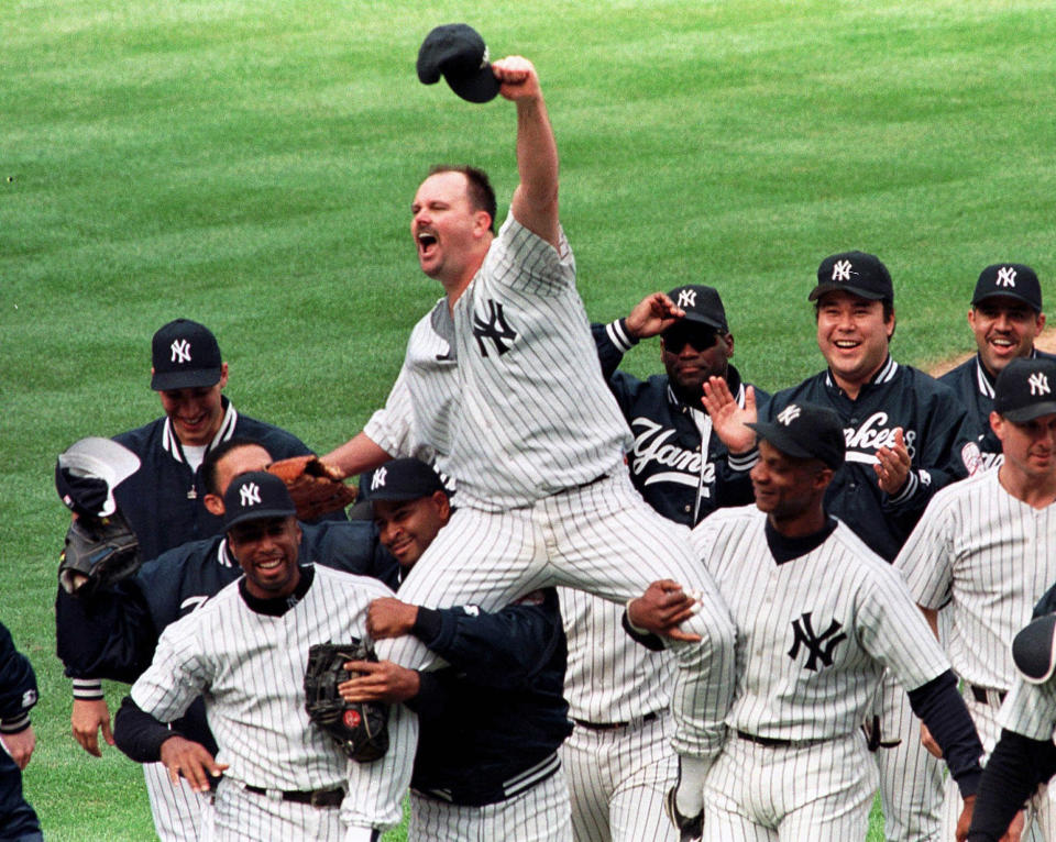 New York Yankees pitcher David Wells is carried off the field by Bernie Williams, left, Willie Banks, second from left, and Darryl Strawberry, right, after pitching a perfect game against the Minnesota Twins on Sunday, May 17, 1998.. (AP Photo/Lou Requena, file)