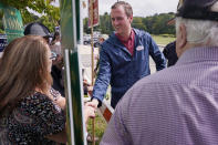 New Hampshire Republican 1st Congressional District Candidate Matt Mowers greets campaign volunteers, Tuesday, Sept. 13, 2022, during a campaign stop at a polling station in Derry, N.H. (AP Photo/Charles Krupa)