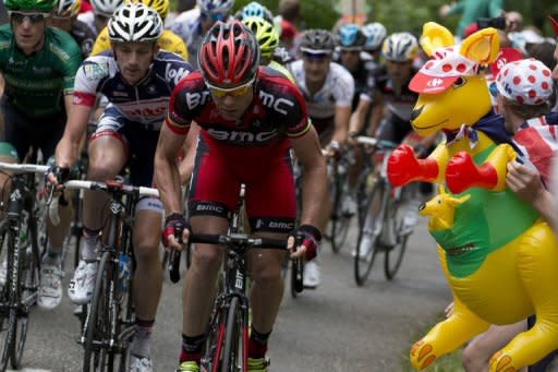 Tour de France 2011 winner, Australia's Cadel Evans (R) rides with Belgium's Jurgen van den Broeck (2nd L) past a kangaroo decoration in the 191 km and fourteenth stage of the 2012 Tour de France cycling race starting in Limoux and finishing in Foix, southern France