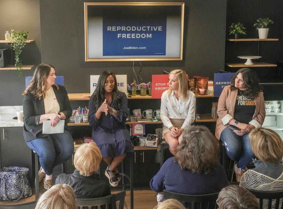 From left to right, Motherhood For Good founding member Erin Phillips, Kaitlyn Joshua of Louisiana, Amanda Zurawski of Texas and Motherhood For Good founding member Danielle Scampini Linn speak during a town hall as Joshua and Zurawski campaign on behalf of President Biden this week in Wisconsin on Monday at Batter & Mac in Menomonee Falls.