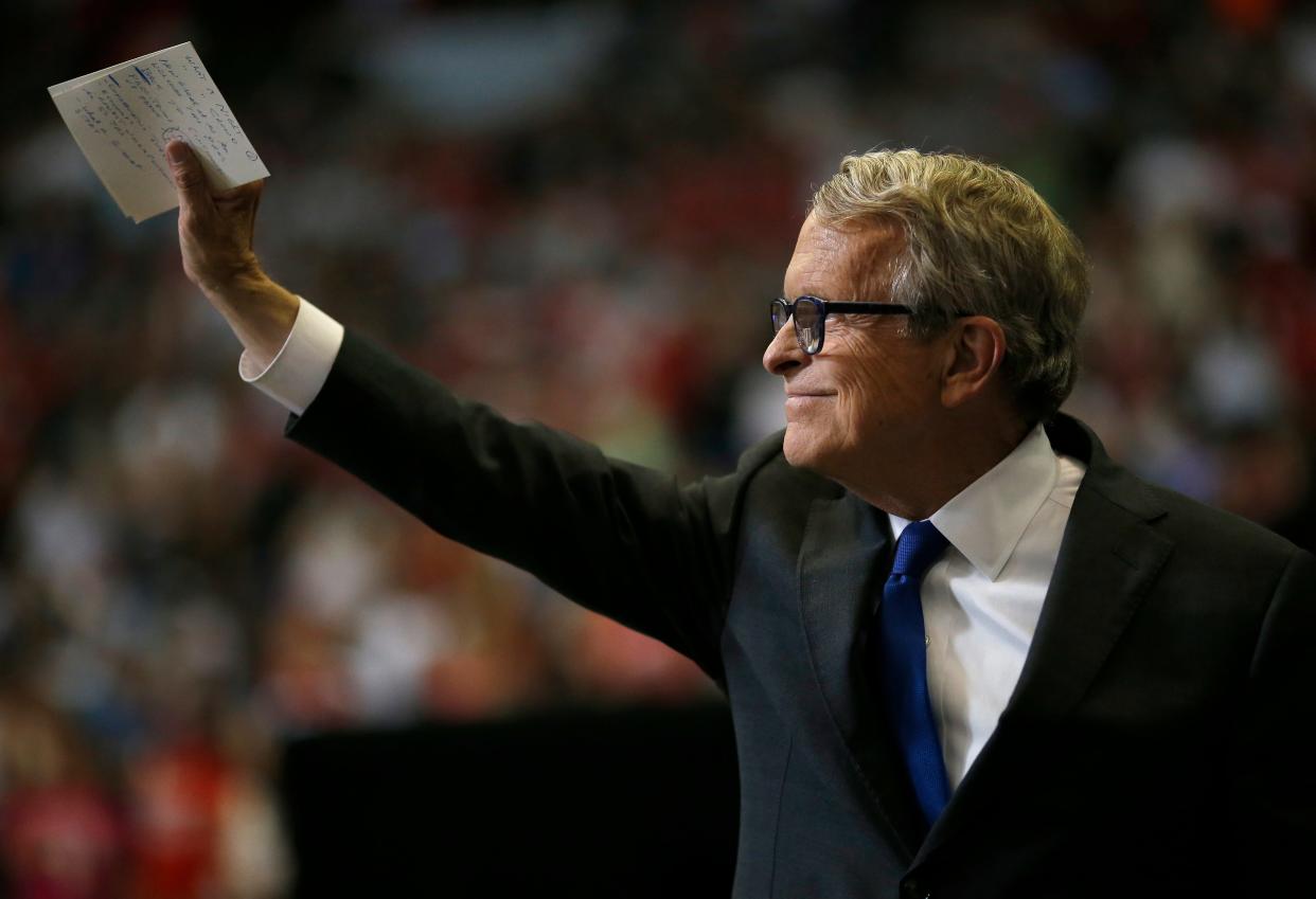 Ohio Gov. Mike DeWine takes the stage to speak before President Donald Trump during a campaign rally at U.S. Bank Arena in Downtown Cincinnati on Thursday, Aug. 1, 2019.