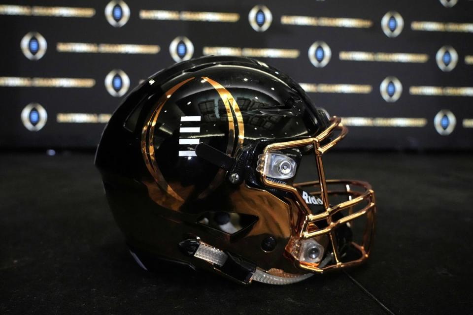 Jan 11, 2022; Indianapolis, Indiana, USA; A detailed view of College Football Playoff National Championship logo helmet at 2022 Indianapolis Host Committee press conference at the JW Marriott. Mandatory Credit: Kirby Lee-USA TODAY Sports