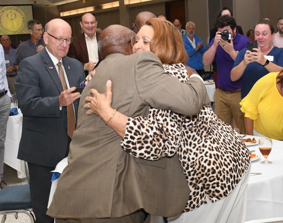 Dr. Haywood Joiner hugs his wife Mary after he was announced as the recipient of the 2022 Rotary Club of Alexandria's Service Above Self Award.