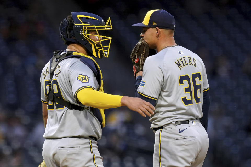 Milwaukee Brewers catcher Gary Sanchez, left, talks with starting pitcher Tobias Myers during the fourth inning of the team's baseball game against the Pittsburgh Pirates on Tuesday, April 23, 2024, in Pittsburgh. (AP Photo/Matt Freed)