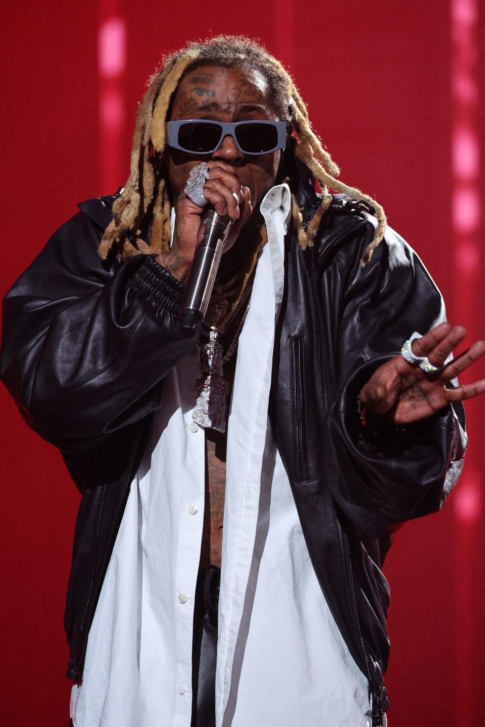 Lil Wayne seemingly reacted to his wax figure at the Hollywood Wax Museum.