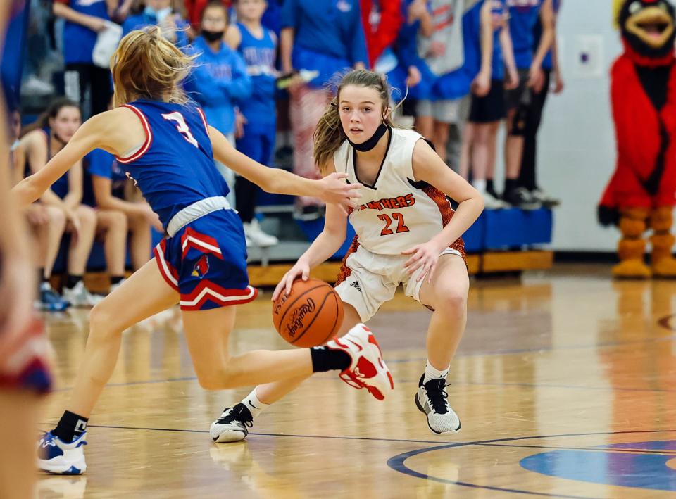 Mazzy O'Brien of Washington Middle School dribbles away from a Pleasant Plains player during the IESA Class 8-3A girls basketball state championship game.