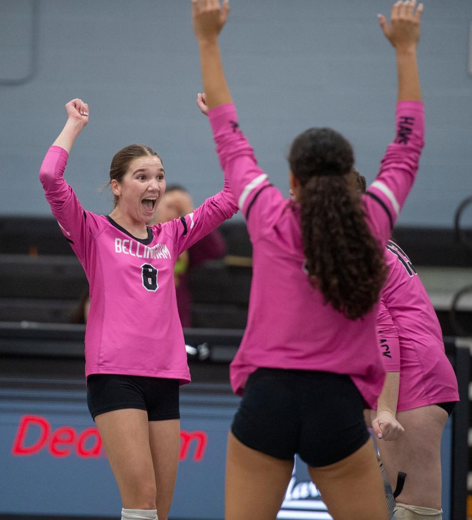 Bellingham High School's Val Nolan, #8, and teammates celebrate a point against Dedham, Oct. 25, 2023.