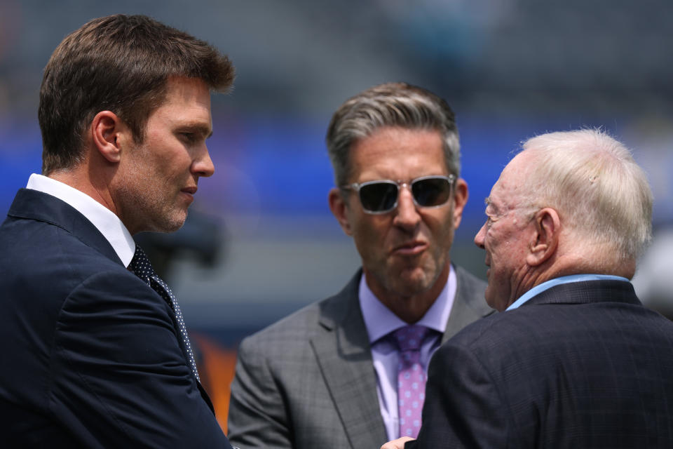 Tom Brady, left, teams up with Kevin Burkhardt, middle, in the Fox broadcast booth. (Harry How/Getty Images)