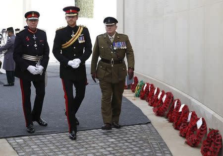 Britain's Prince Harry (C) attends Armistice Day commemorations at the National Memorial Arboretum in Alrewas, Britain, November 11, 2016. REUTERS/Darren Staples