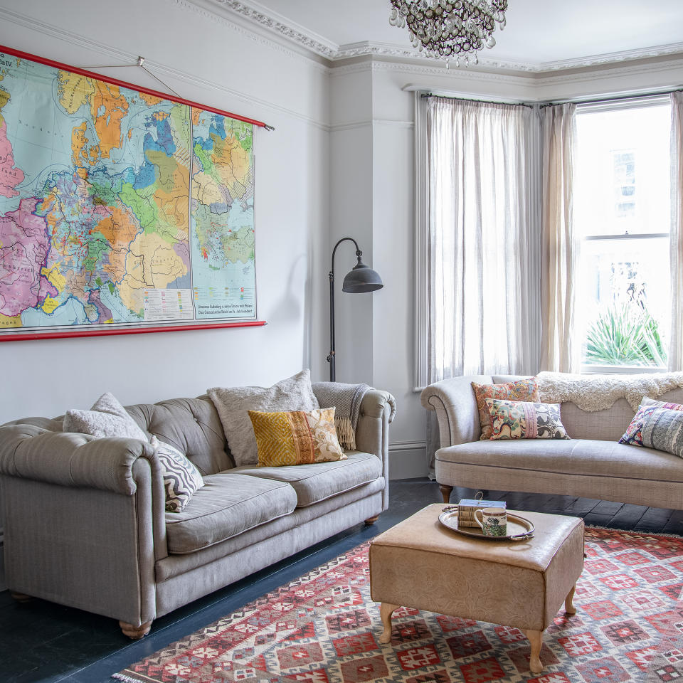 living room with vintage furniture, neutral scheme and bay window