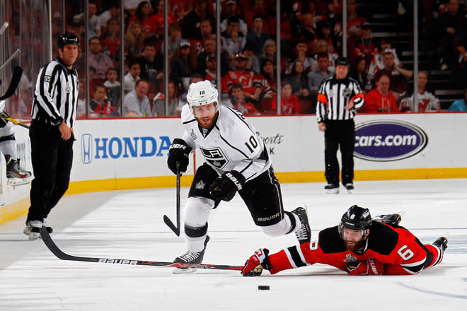  Mike Richards #10 Of The Los Angeles Kings Goes For A Loose Puck As Andy Greene #6 Of The New Jersey Devils Hits The  Getty Images