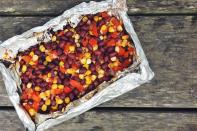<p>Flex your Tex-Mex muscles at the next campfire with this quick and mess-free recipe. </p><p>Get the recipe from <a href="https://www.delish.com/cooking/recipe-ideas/recipes/a43187/foil-pack-tex-mex-black-bean-salad-recipe/" rel="nofollow noopener" target="_blank" data-ylk="slk:Delish;elm:context_link;itc:0;sec:content-canvas" class="link ">Delish</a>.</p>