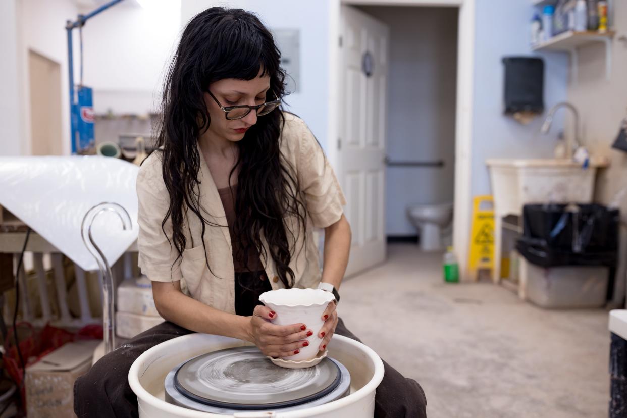 Philip John "PJ" Romero's student Nicole Verlade works on her piece in his ceramics studio, PJ Romero Artworks, 120 S. Carolina Dr. in El Paso, TX, on Tuesday, June 18, 2024.