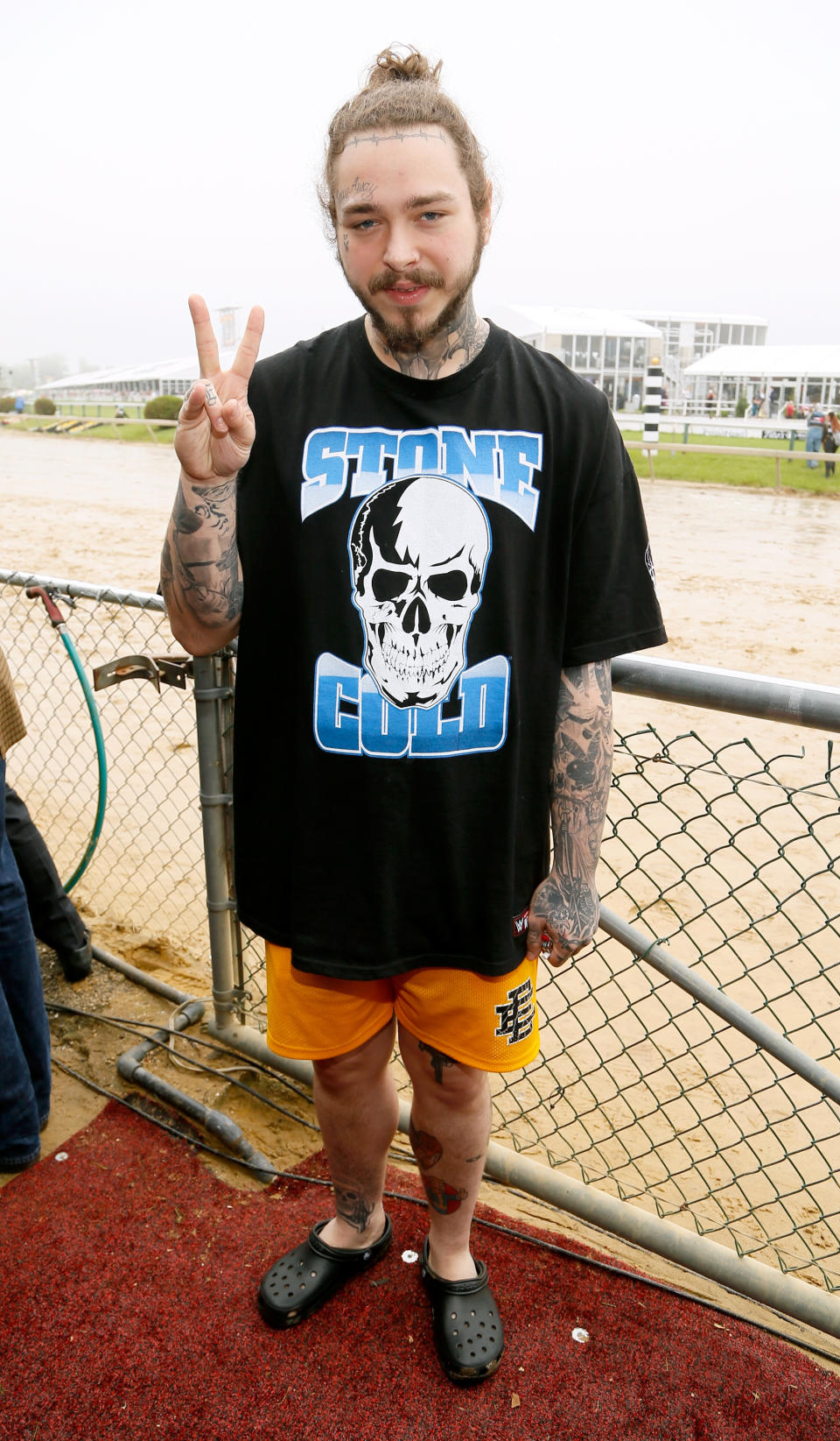 Post Malone wearing classic black Crocs on May 19, 2018 in Baltimore, Maryland. [Photo: Getty]