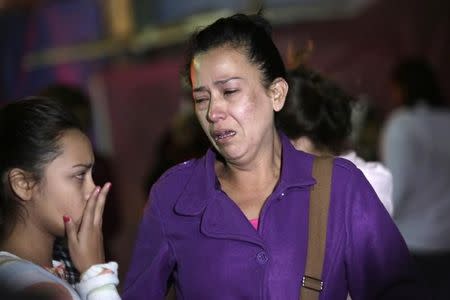 Family members of inmates react as they stand outside the Topo Chico Prison in Monterrey, Mexico, February 11, 2016. REUTERS/Daniel Becerril