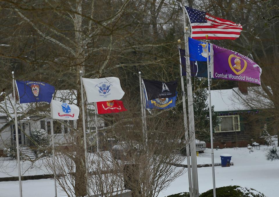 Snow fall in the Spartanburg County area on Jan 16, 2022.  The flags of the nation in the snow fall at Duncan Park in Spartanburg.