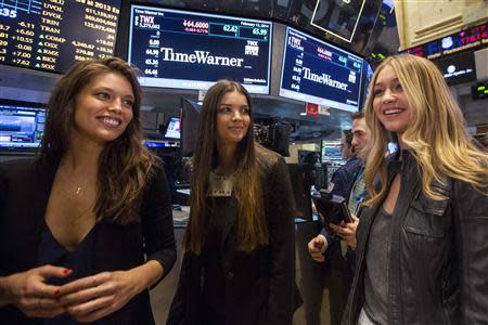 2014 Sports Illustrated Swimsuit models (from L to R) Emily DiDonato, Natasha Barnard and Gigi Hadid tour the floor of the New York Stock Exchange February 13, 2014. REUTERS/Brendan McDermid