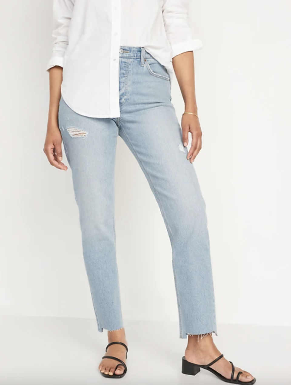 model in white button down shirt, black strappy sandal heels and High-Waisted Button-Fly Slouchy Straight Ripped Cut-Off Jeans (Photo via Old Navy)