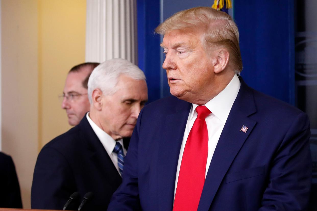 Donald Trump and Mike Pence arrive for a White House briefing on the coronavirus pandemic: AP