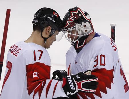 Ice Hockey – Pyeongchang 2018 Winter Olympics – Men Preliminary Round Match - Switzerland v Canada - Kwandong Hockey Centre, Gangneung, South Korea – February 15, 2018 - Rene Bourque (R) and goalkeeper Ben Scrivens of Canada celebrate after defeating Switzerland. REUTERS/Grigory Dukor