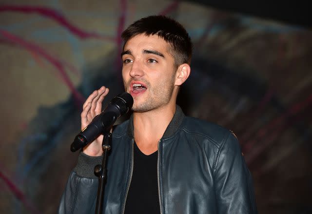 <p>Amanda Edwards/WireImage</p> Tom Parker performs in 2013.