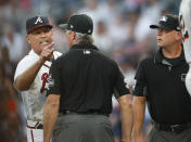Atlanta Braves manager Brian Snitker argues with the umpiring crew after Ronald Acuna Jr was hit by a pitch from Miami Marlins starting pitcher Jose Urena during the first inning of a baseball game Wednesday , Aug. 15, 2018 in Atlanta. Urena was ejected. (AP Photo/John Bazemore)