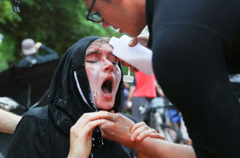 Police clash with protestors attempting to pull down statue of U.S. President Andrew Jackson in front of the White House in Washington