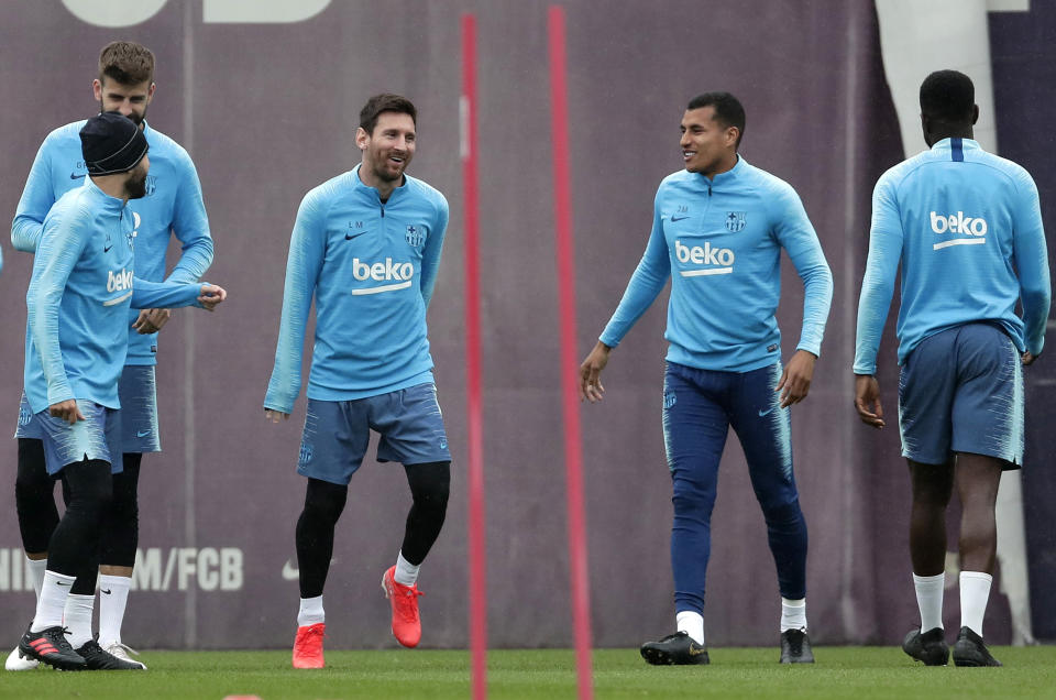 FC Barcelona's Lionel Messi, center left takes part in a training session with teammates at the Sports Center FC Barcelona Joan Gamper in Sant Joan Despi, Spain, Friday, May 24, 2019. FC Barcelona will play against Valencia in the Spanish Copa del Rey soccer match final on Saturday. (AP Photo/Manu Fernandez)