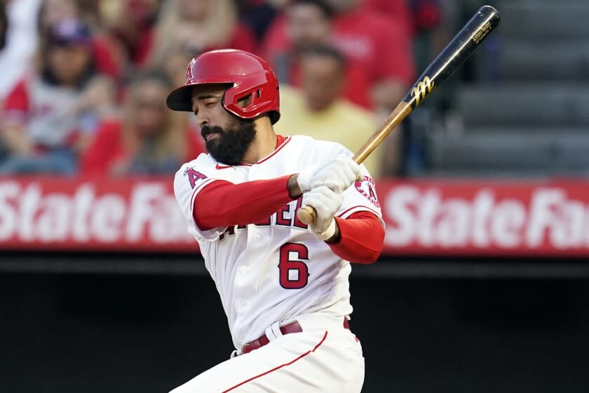 Los Angeles Angels' Anthony Rendon follows through on an RBI single during the first inning.