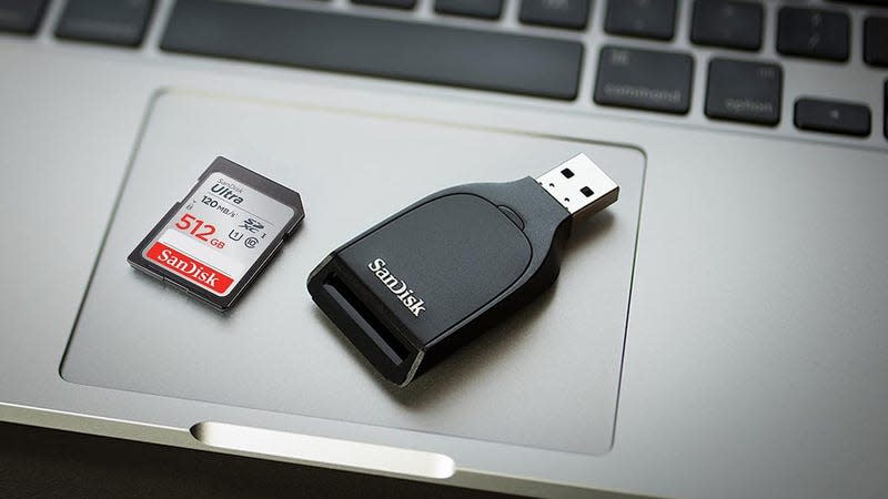 Photo of an SD Card next to an SD Card Reader