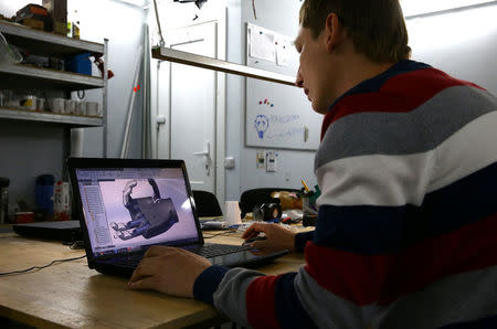 Design engineer Sergey Arefyev works at his workshop on a prosthetic right hand for his colleague's father, in Minsk, Belarus October 16, 2016. REUTERS/Vasily Fedosenko