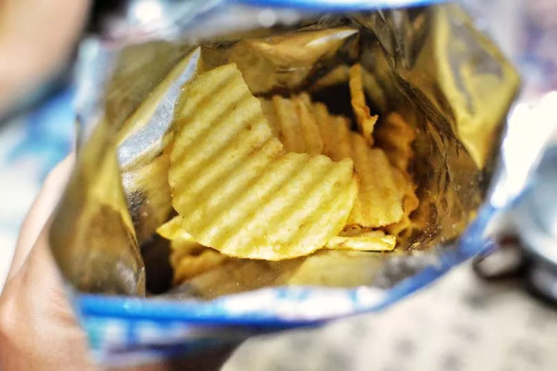 A general image of an opened bag of crisps